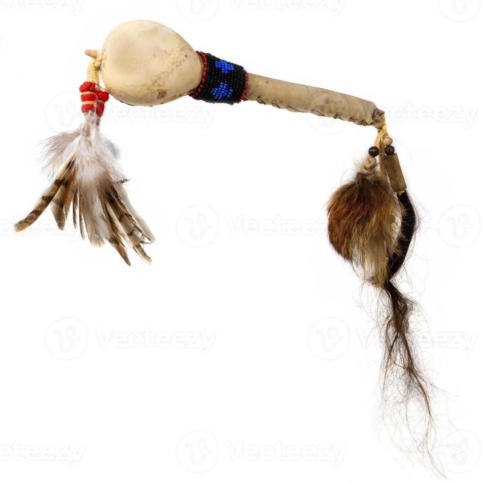 Replica of a North American Indian dance rattle made of gourd with glass beads and feathers photo