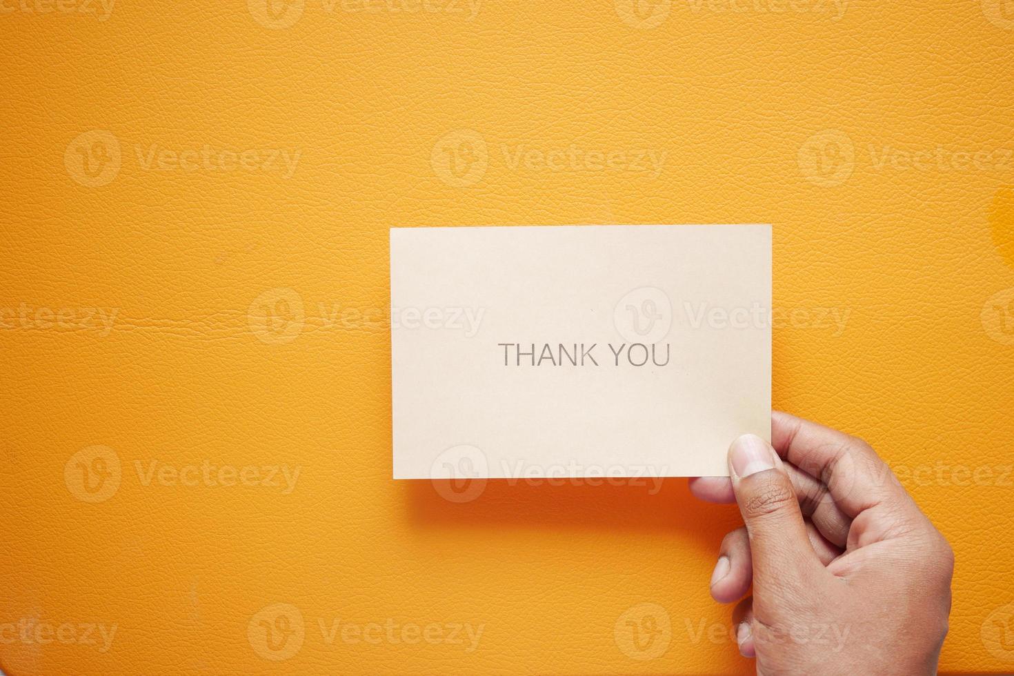 man hand reading a thank you letter photo