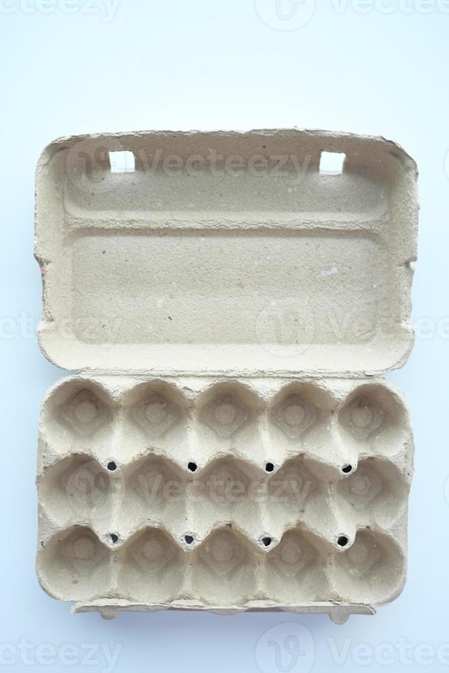 egg carton without eggs on table , photo