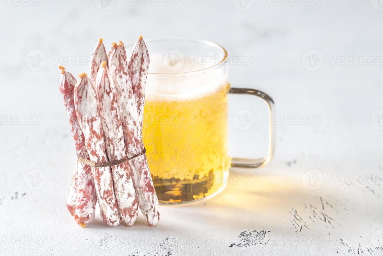 Snack fuet sausages with beer photo