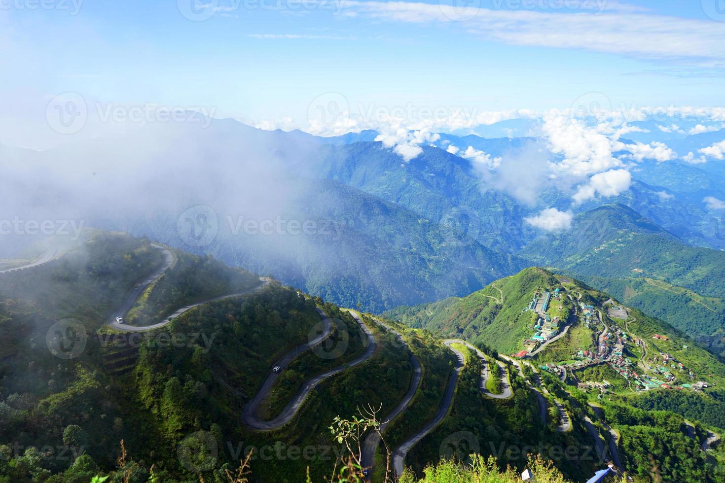 Old Silk Route Zig Zag Road with Zuluk Village in Background photo