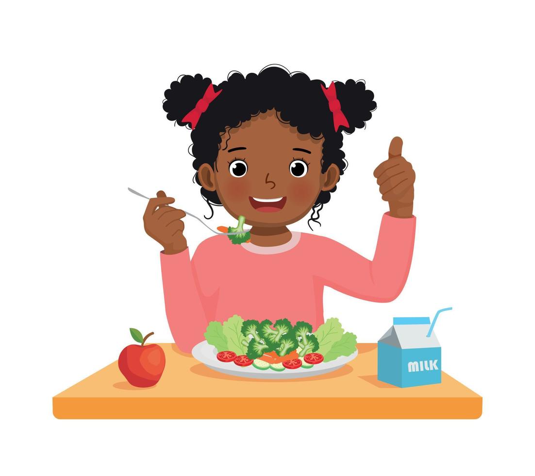 Cute little African girl eating broccoli healthy vegetables with fork showing thumb up gesture vector