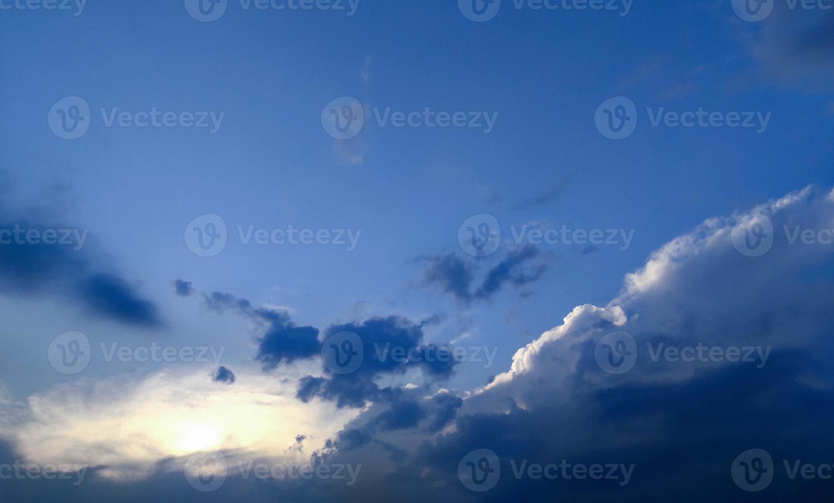 black Clouds in the blue sky, sunset over the blue sky photo