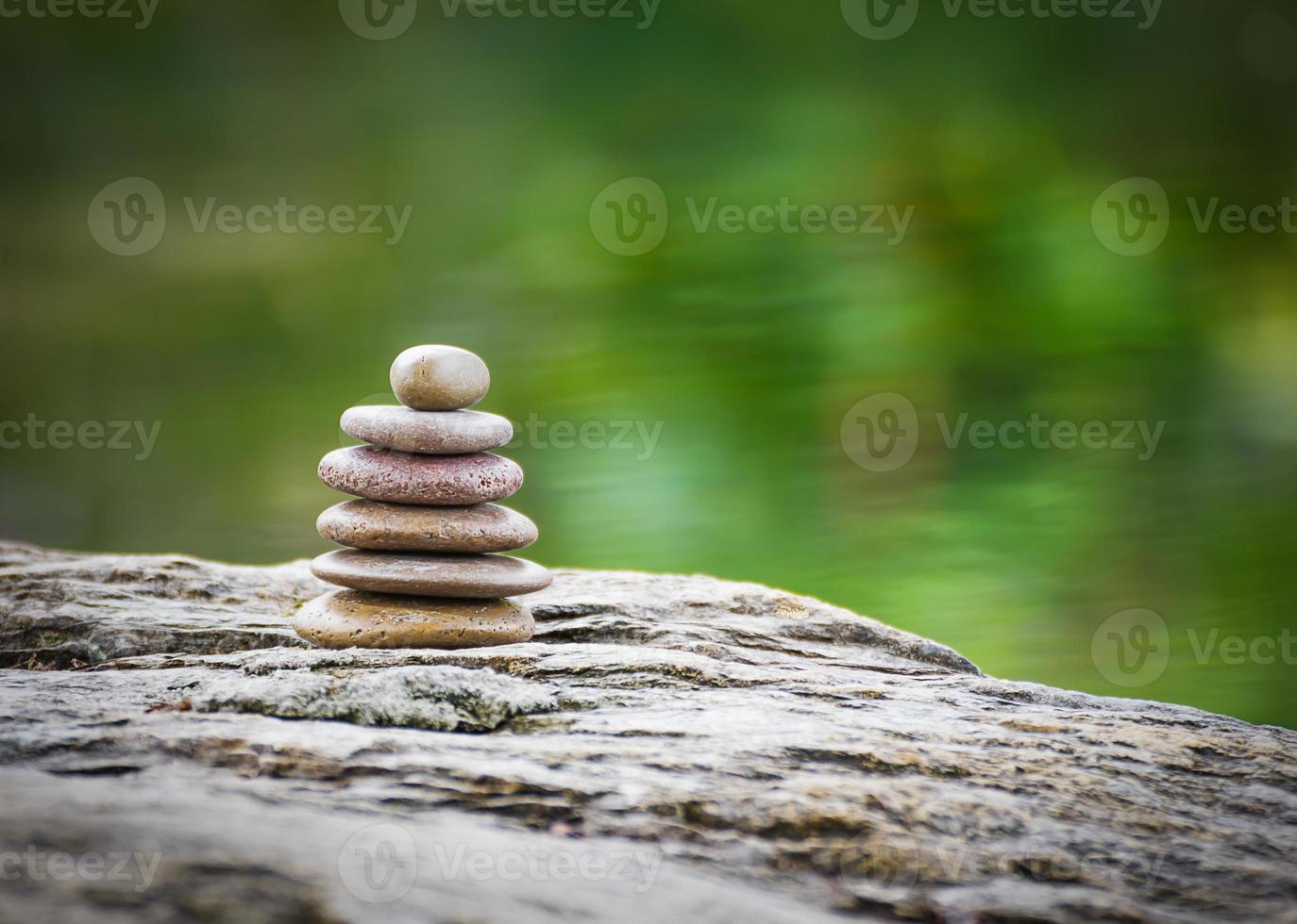 Stack of zen rocks in garden photo