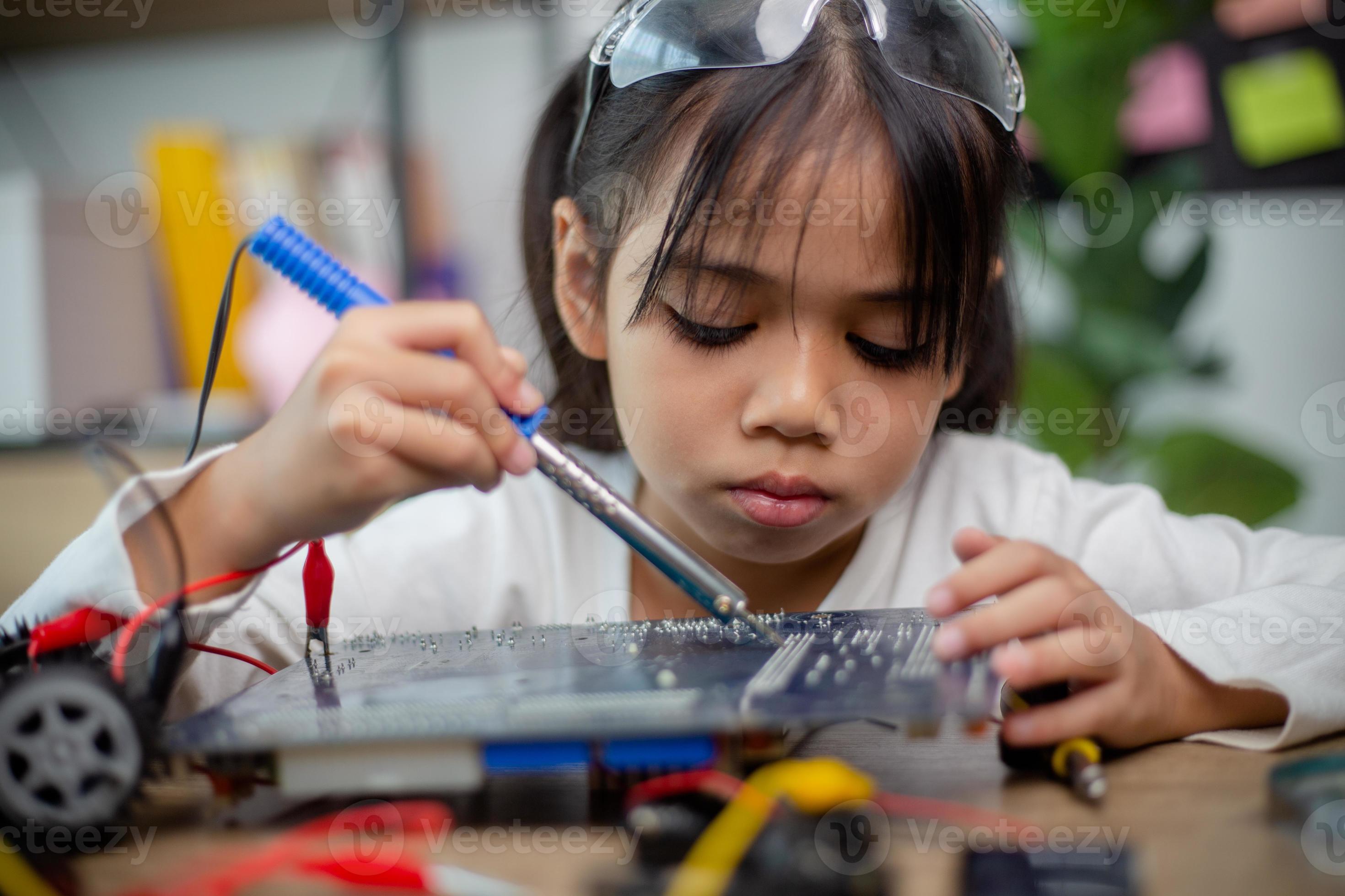 asia-students-learn-at-home-in-coding-robot-cars-and-electronic-board