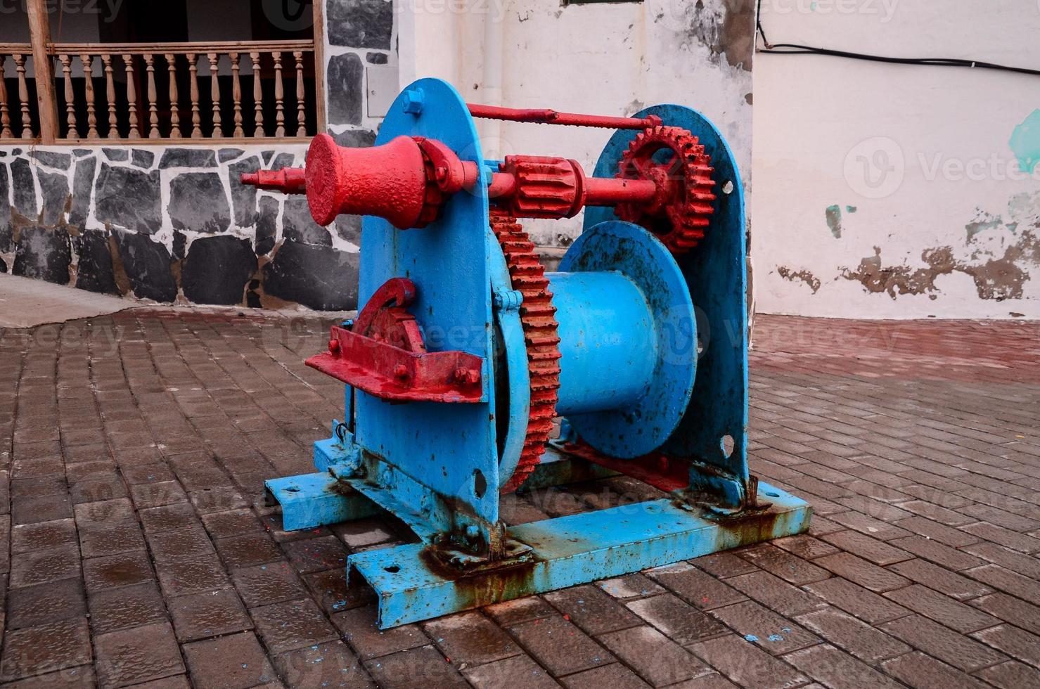 Old Vintage Metal Winch in a Port Harbor photo