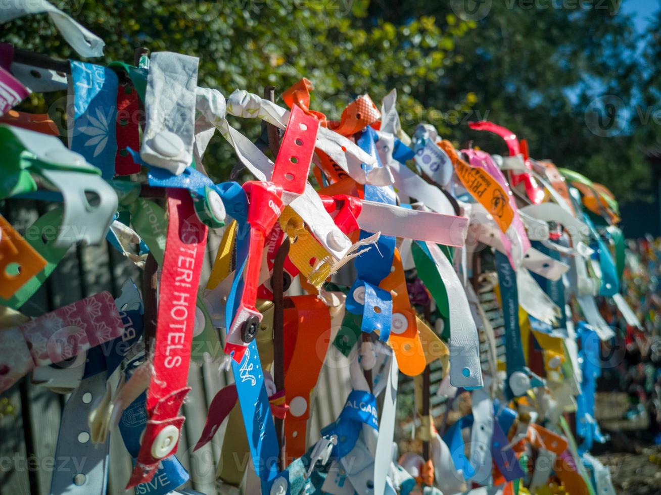 Bulgaria, Romania border, 19.10.2022. Plastic and rag bracelets with the names of hotels in resorts of Bulgaria, left as a souvenir by tourists leaving Bulgaria on the Romanian border photo