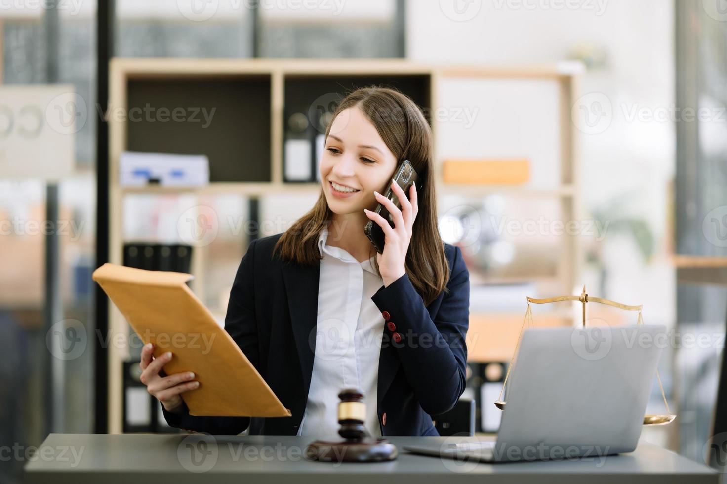 Woman lawyer working and gavel, tablet, laptop in front, Advice justice and law concept. photo