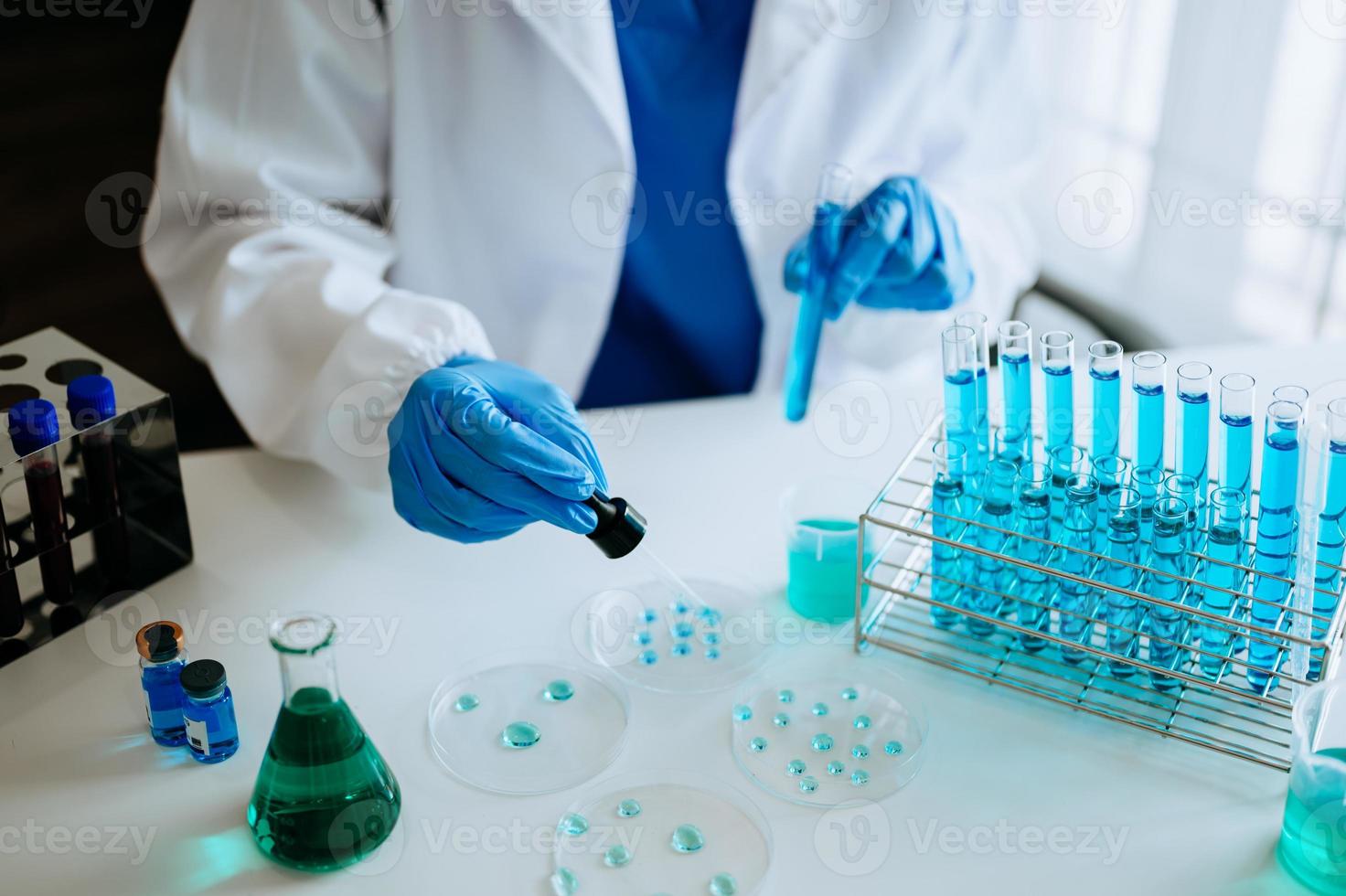 Female scientist researcher conducting an experiment in a laboratory. photo