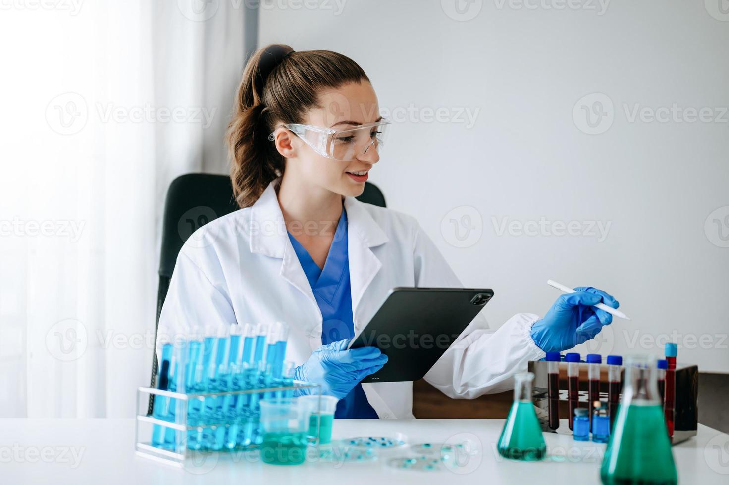 Female scientist researcher conducting an experiment in a laboratory. photo