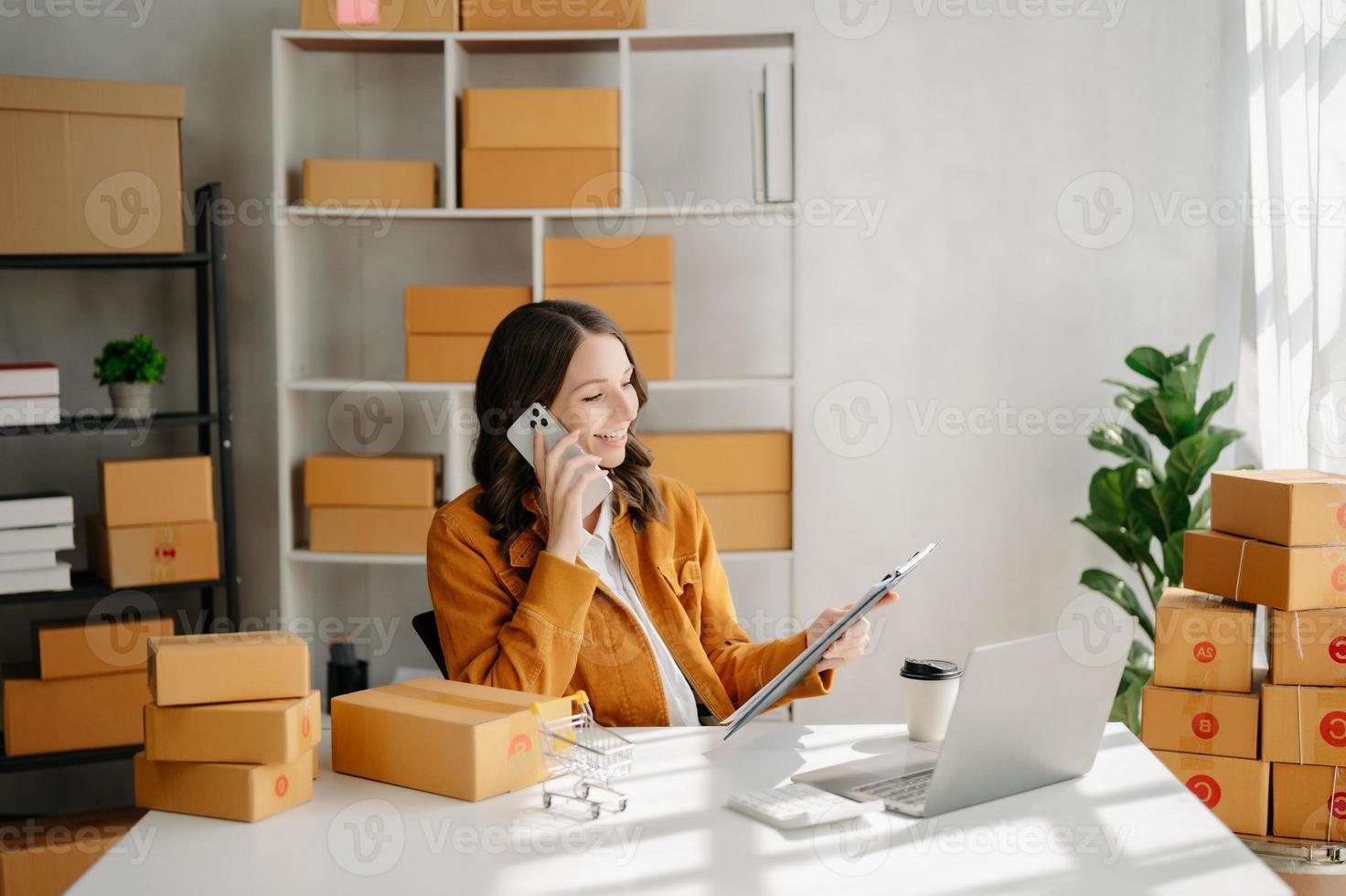 Small business entrepreneur SME freelance woman working at office, BOX,tablet and laptop online, marketing, packaging, delivery,  e-commerce concept photo