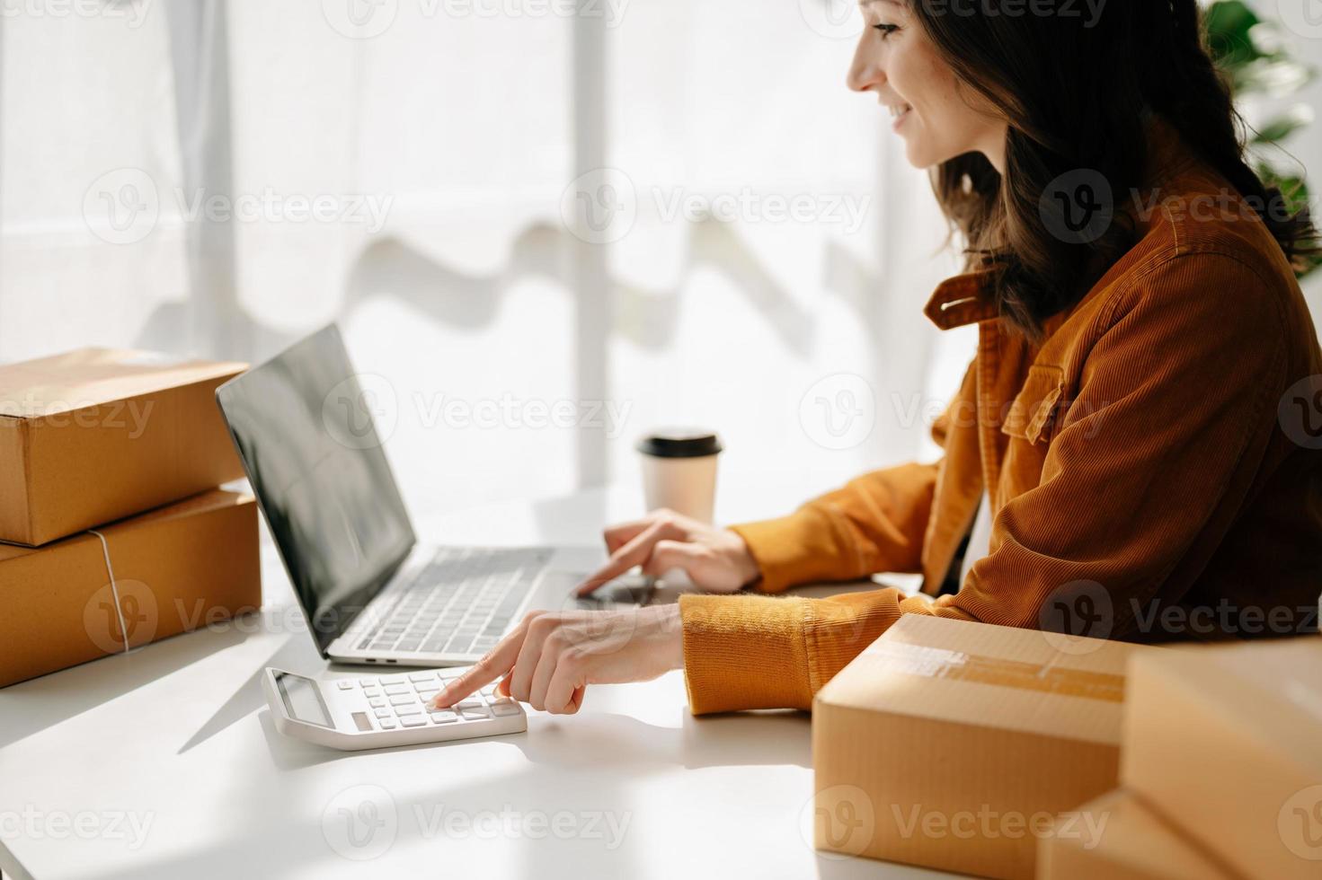 Small business entrepreneur SME freelance woman working at office, BOX,tablet and laptop online, marketing, packaging, delivery,  e-commerce concept photo