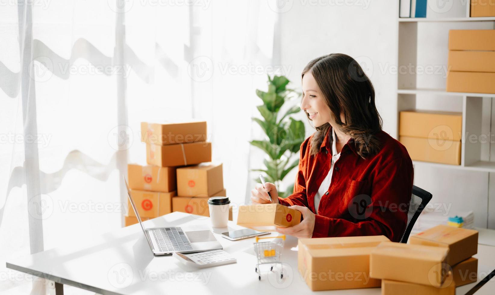 Small business entrepreneur SME freelance woman working at office, BOX,tablet and laptop online, marketing, packaging, delivery,  e-commerce concept photo