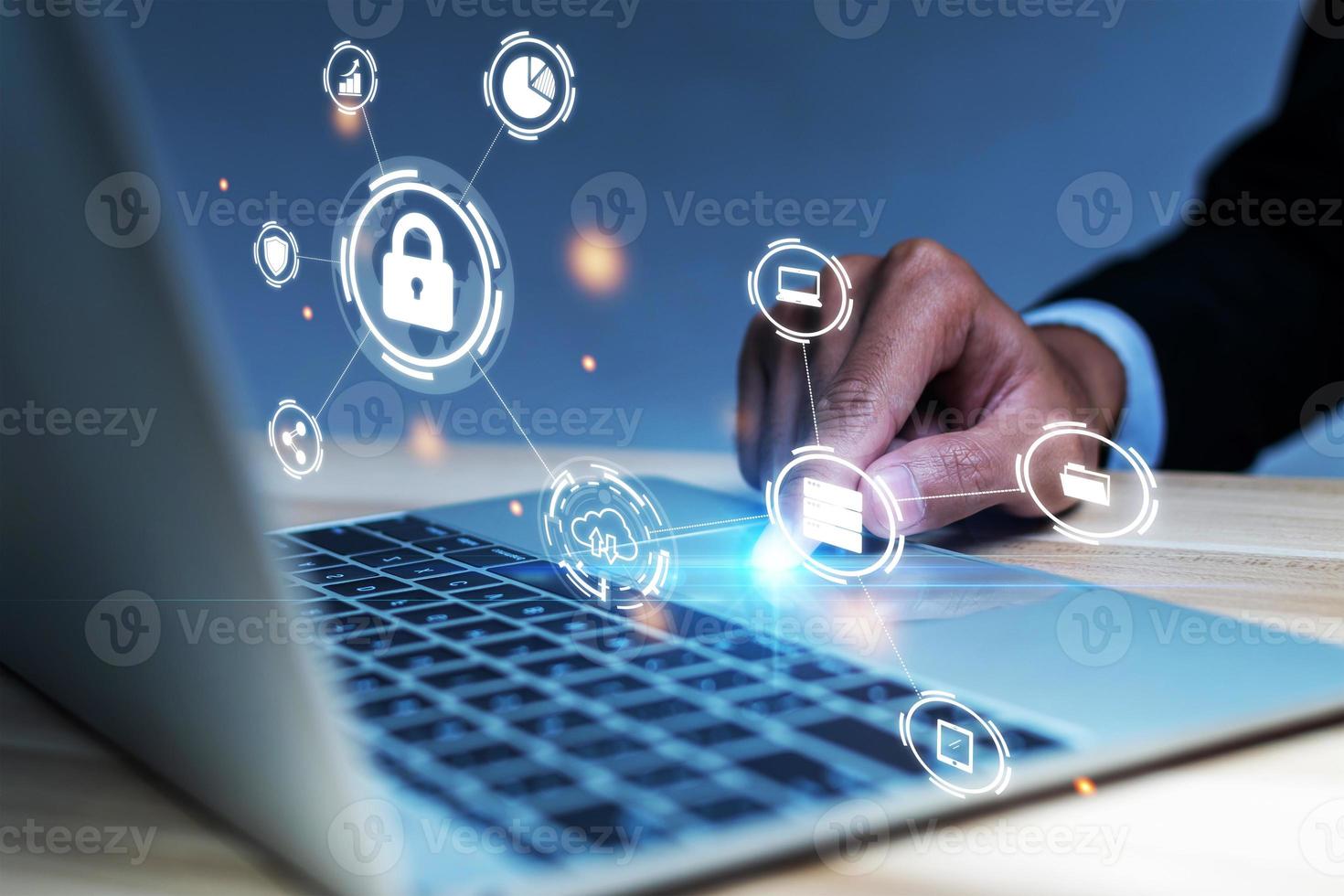 Cyber Security. business man hand working on laptop computer with virtual graphic icon diagram on desk at office, contact us, digital marketing, business finance, internet network technology concept photo