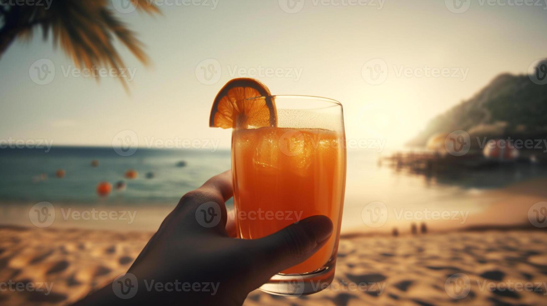 hand holding a glass of juice, beach, seaside, summer vibes, palm trees photo