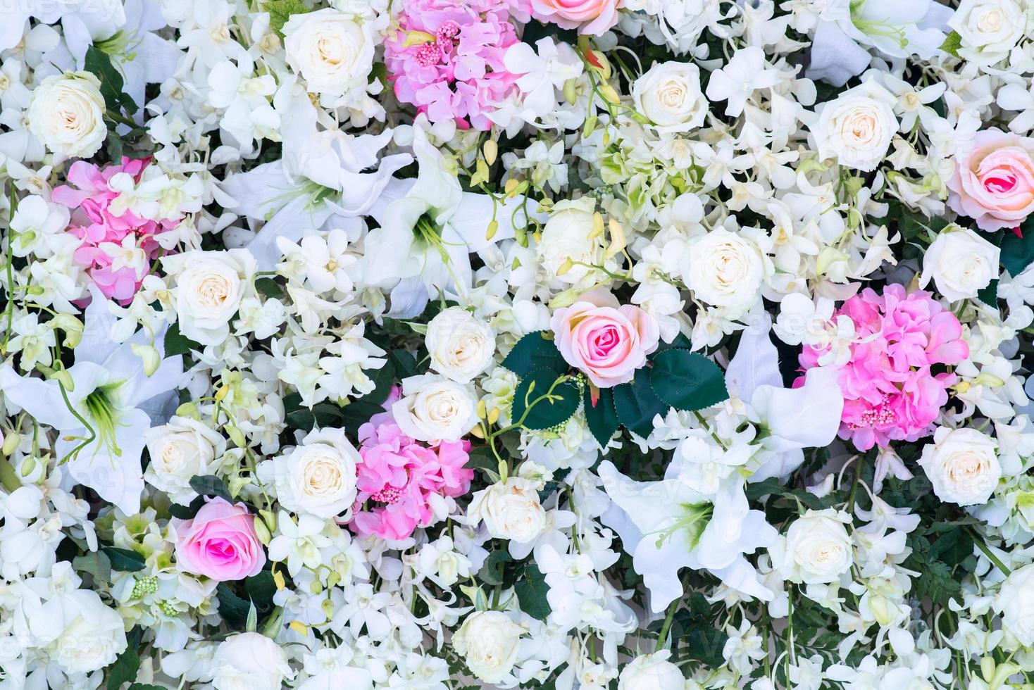 Floral background. Lot of artificial flowers in colorful composition photo