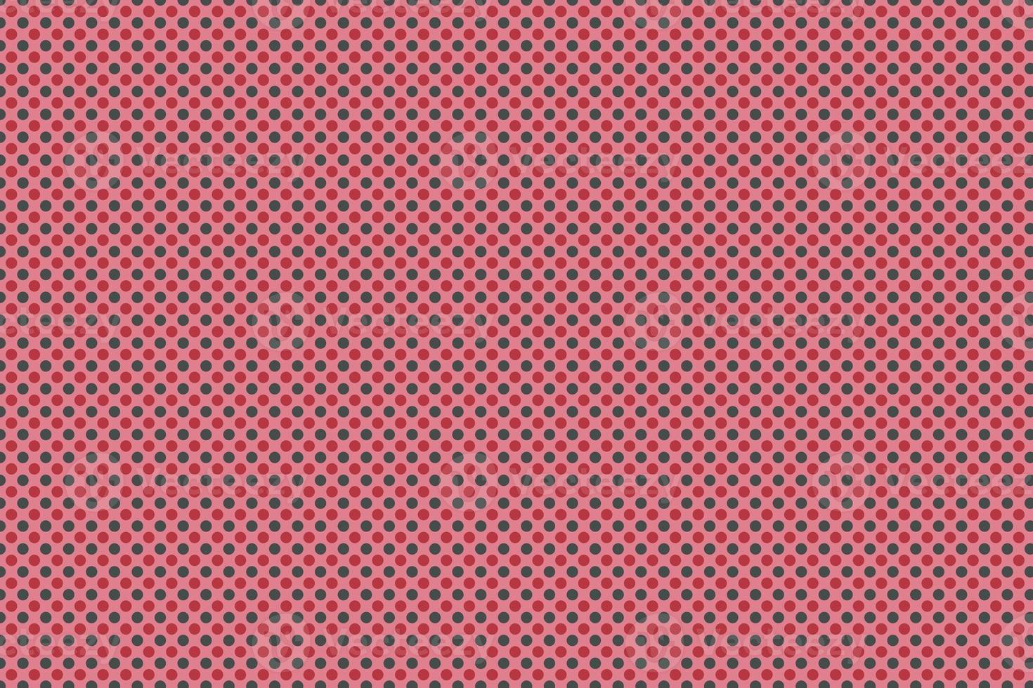 red and black dot on pink background photo