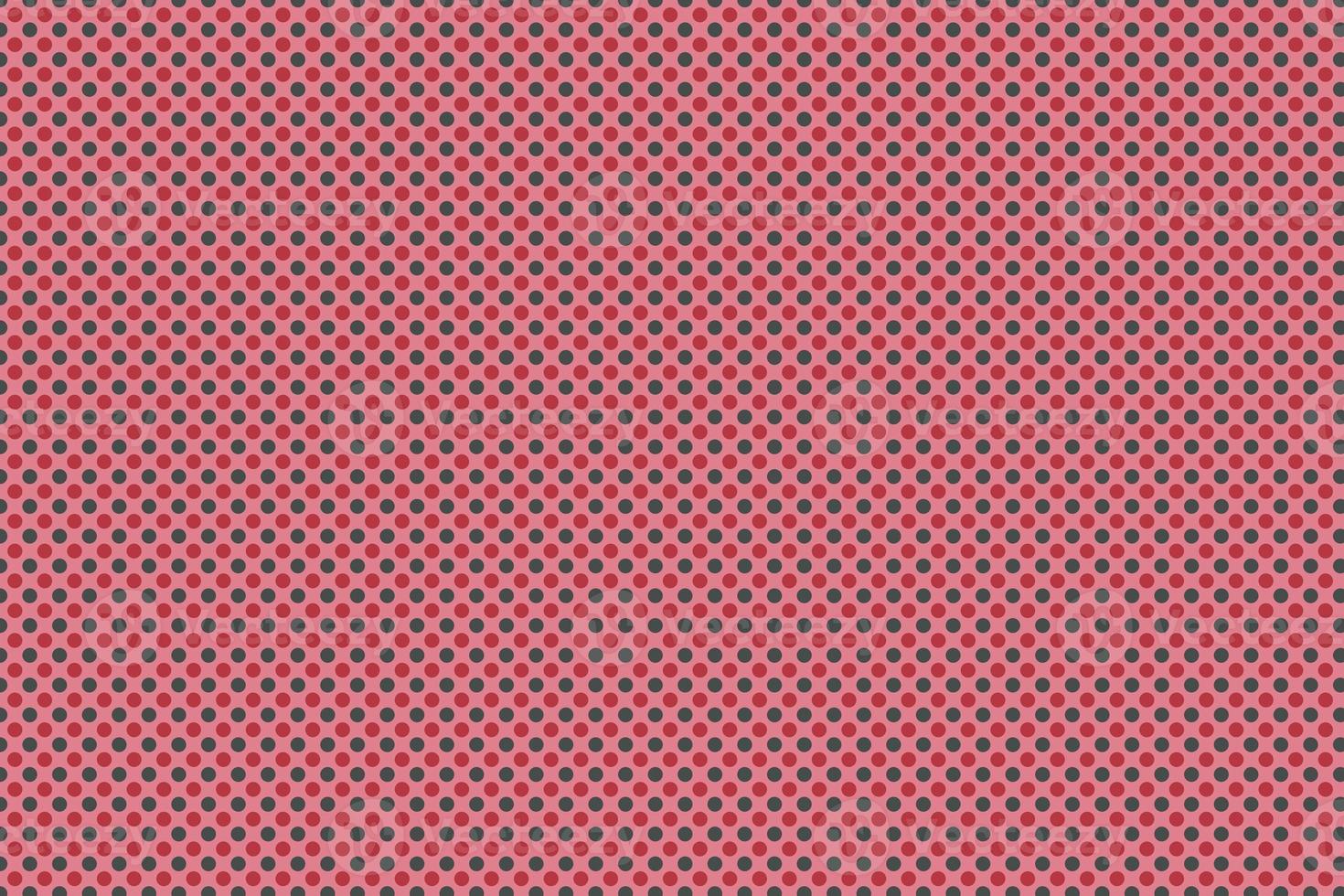 red and black dot on pink background photo