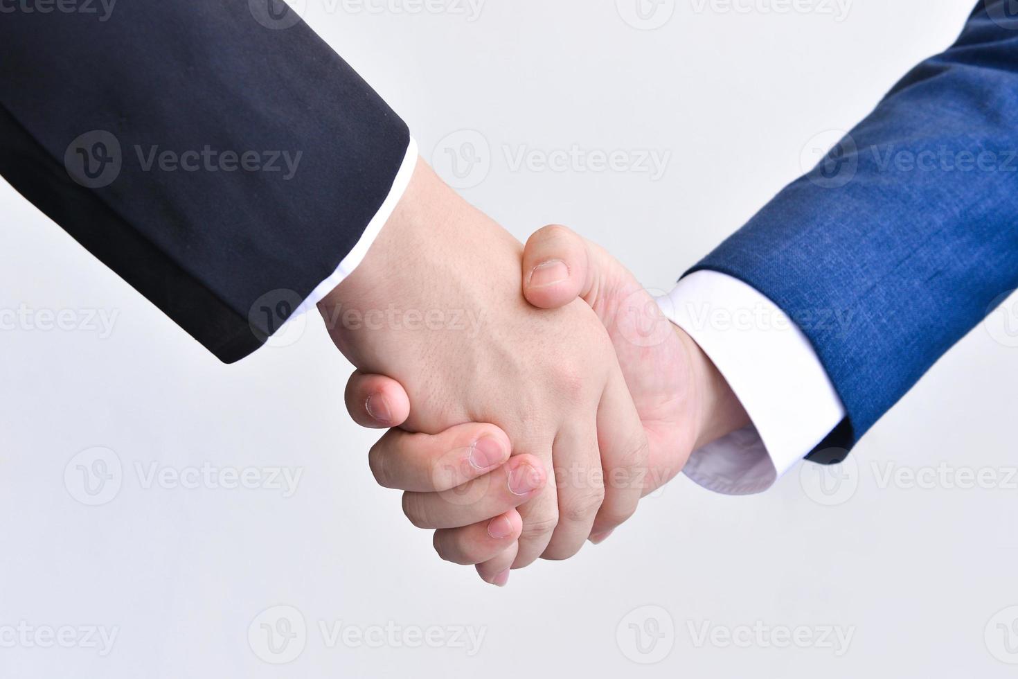 Two business men shaking hands photo