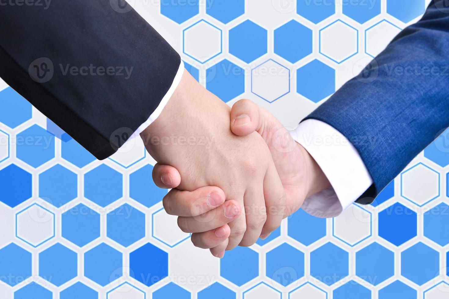 Two business men shaking hands photo