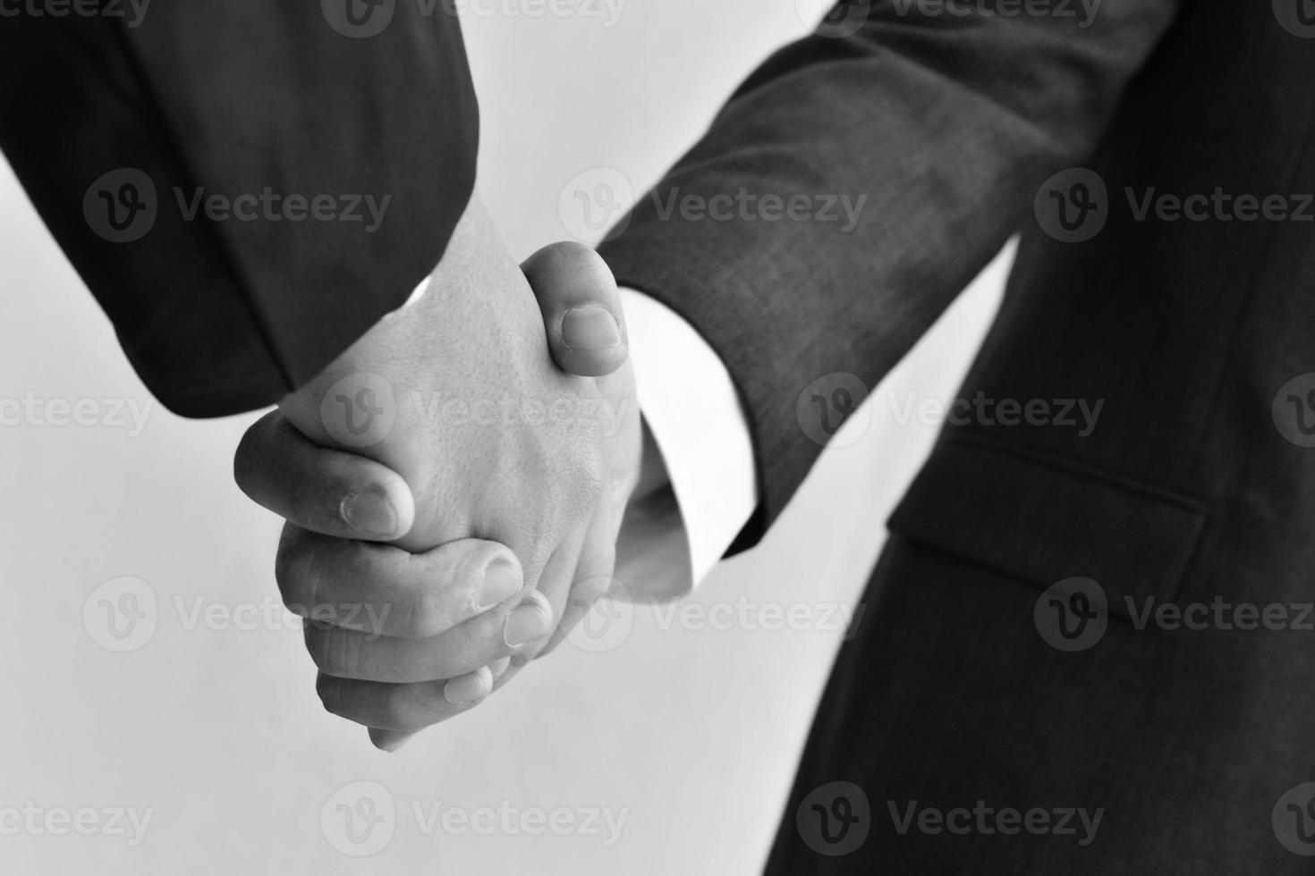 Two business men shaking hands photo