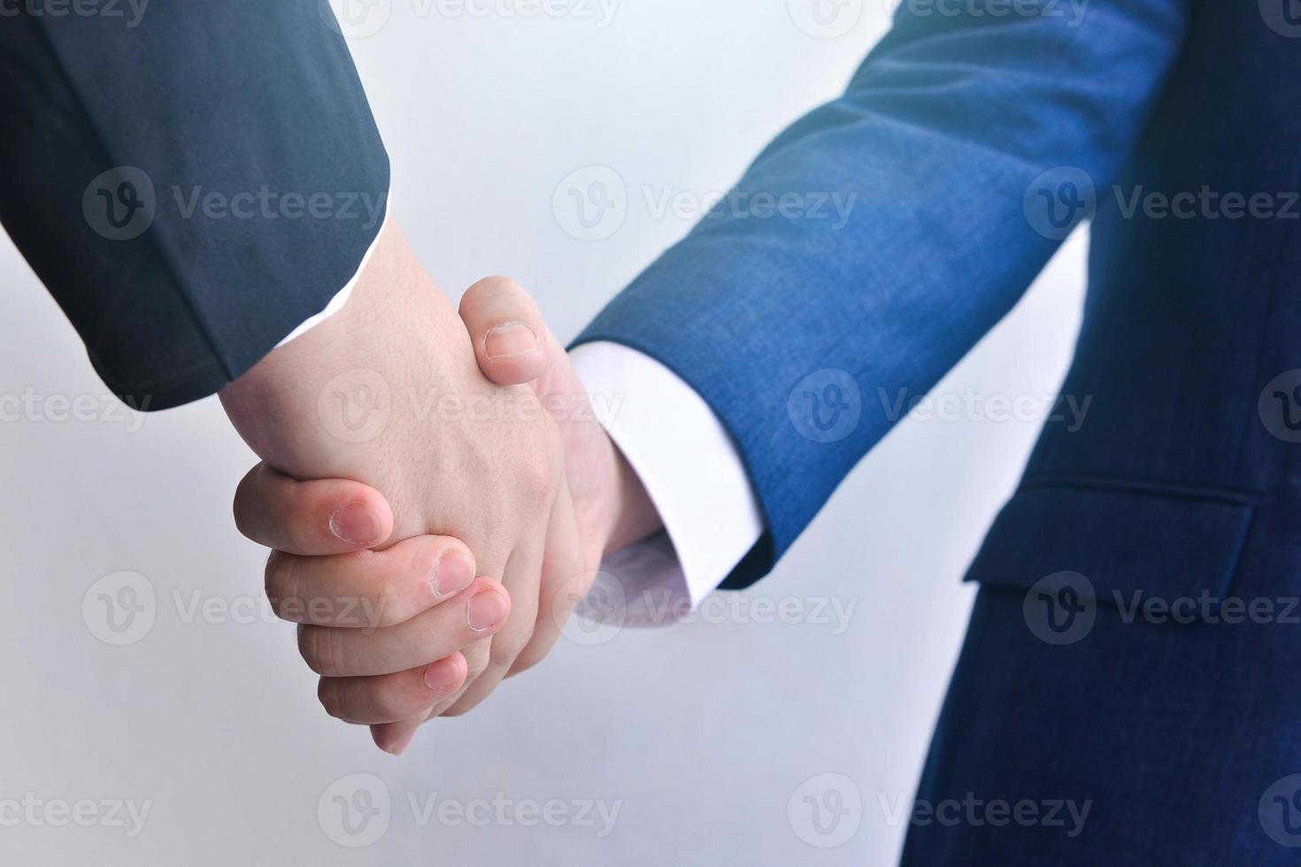 Two business men shaking hands photo