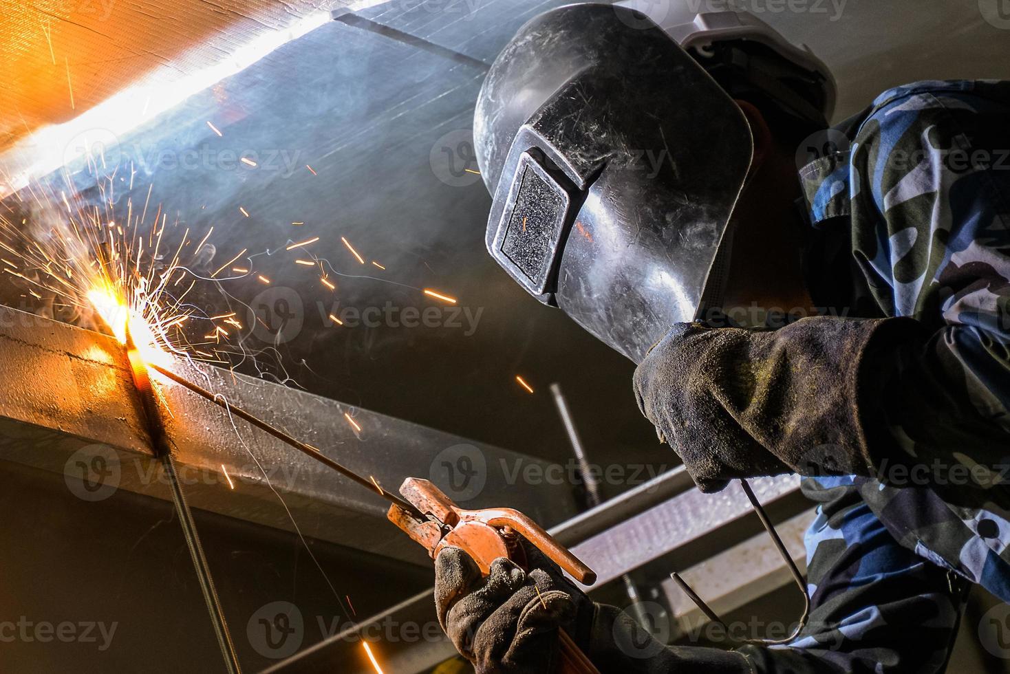 Arc welding of a steel in construction site photo