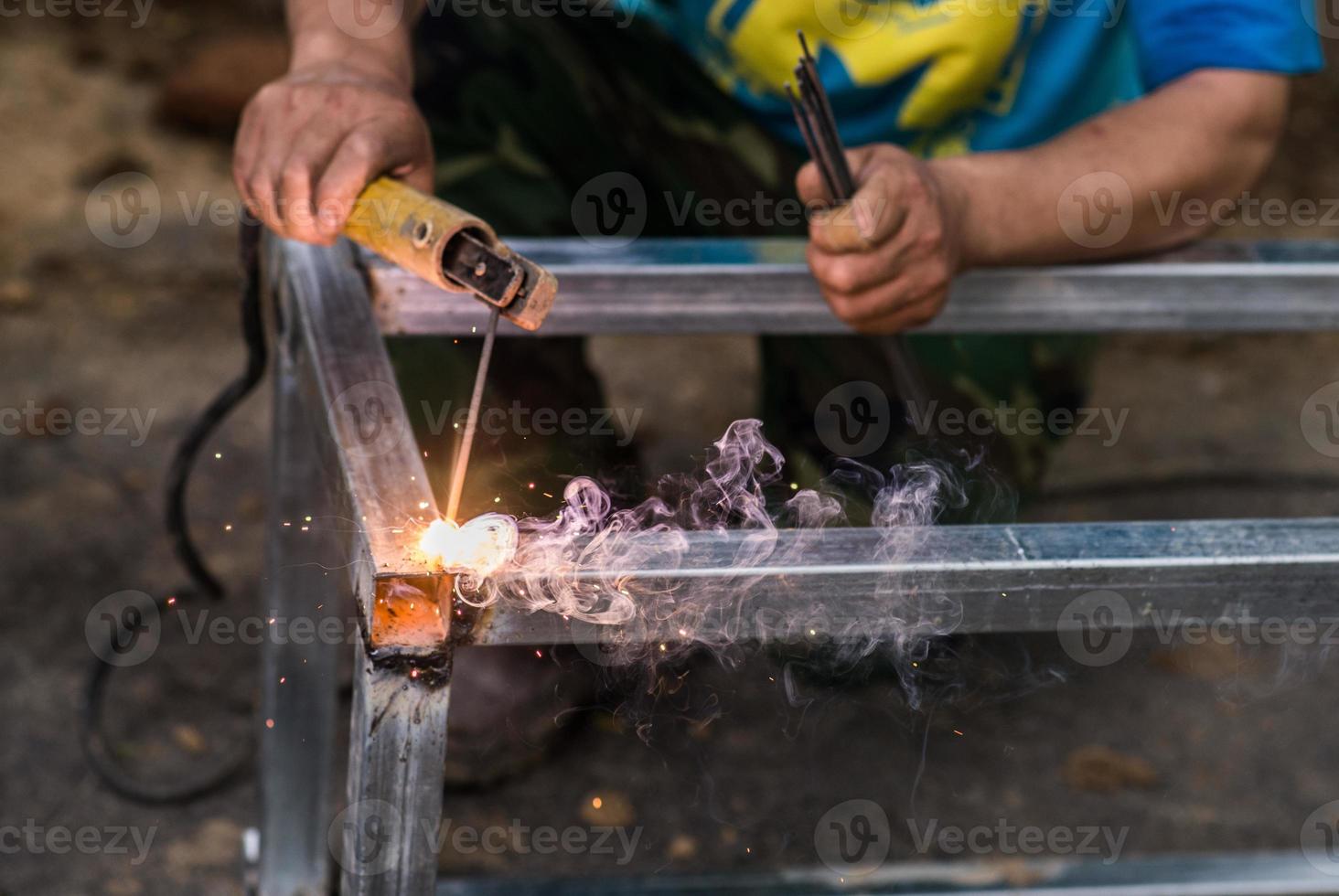 Arc welding of a steel at work site photo