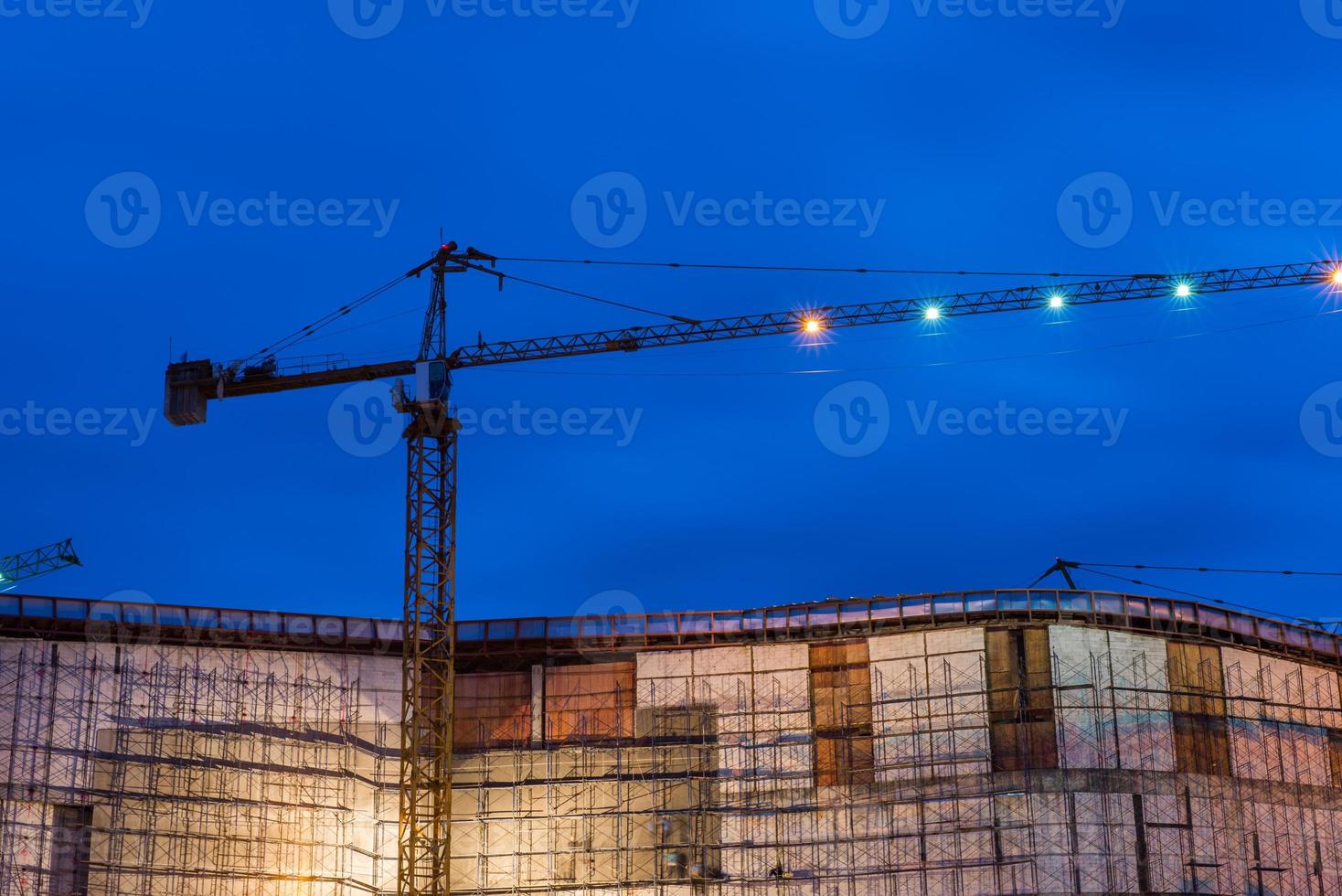 Construction site with cranes in twilight time photo