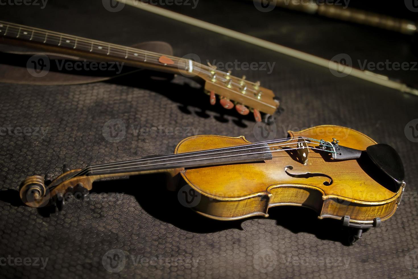 Antique violin on a dark background. Retro musical instrument. photo