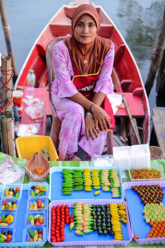 SONGKHLA, THAILAND, April 15, 2018, Sellers sell food and souvenirs at Klonghae Floating Market in Hat Yai, Thailand. The First floating Market in the South of Thailand. photo