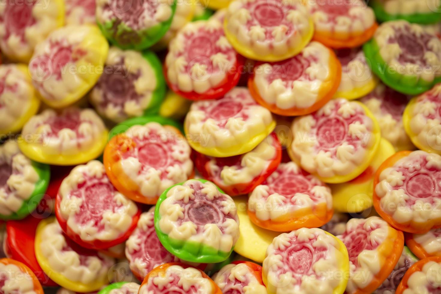 Sweets background. Bright gummy candies close-up. Close-up of colorful jujube background pattern photo
