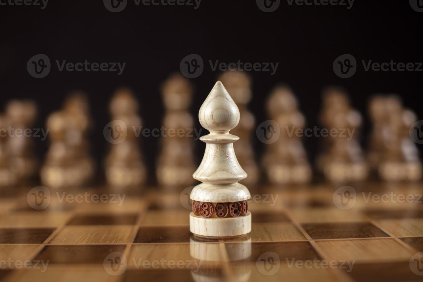Chess on a dark background. A puzzle game with tricky combinations that requires planning and thinking. photo