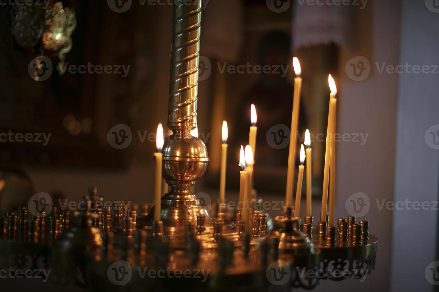 Burning church candles on a dark background, Christian symbol. photo
