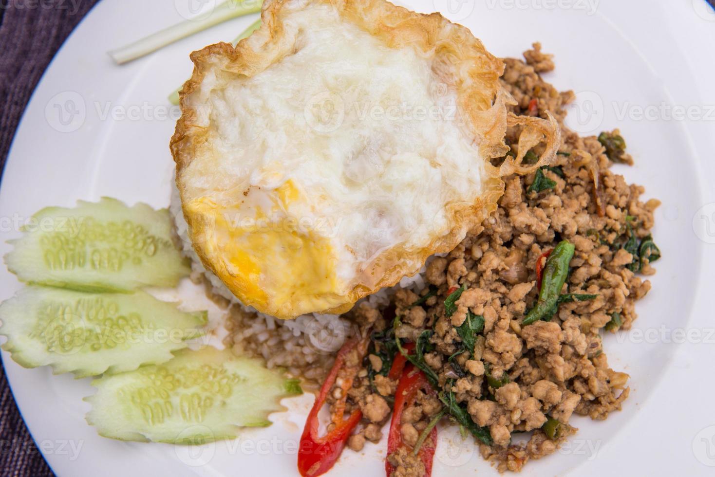 Kapao Moo, Fried pork with chili and basil leaves with rice photo