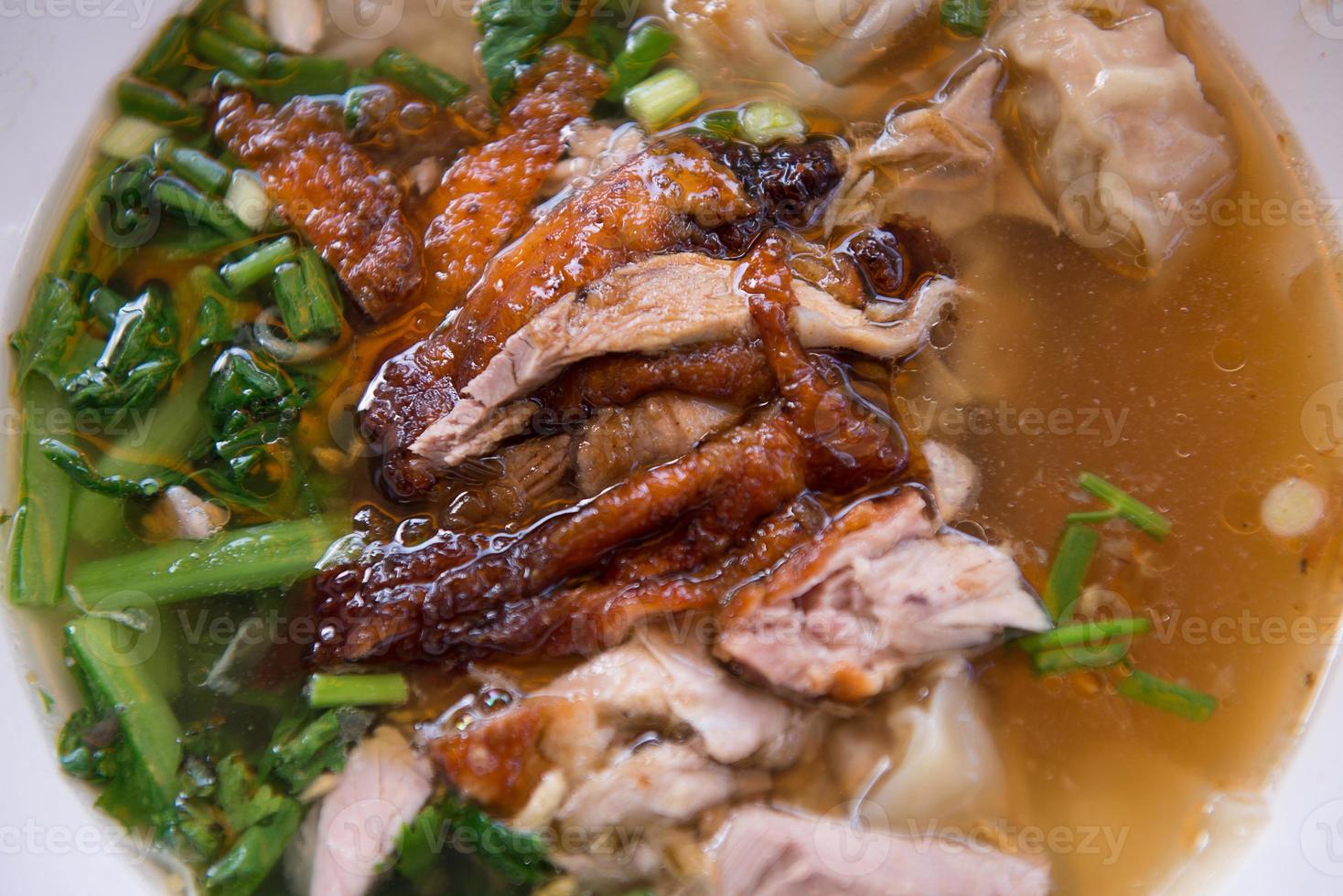 Roasted duck with dumpling in soup photo