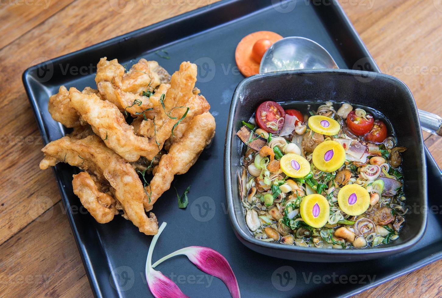 Fried fish with chili mix soup photo