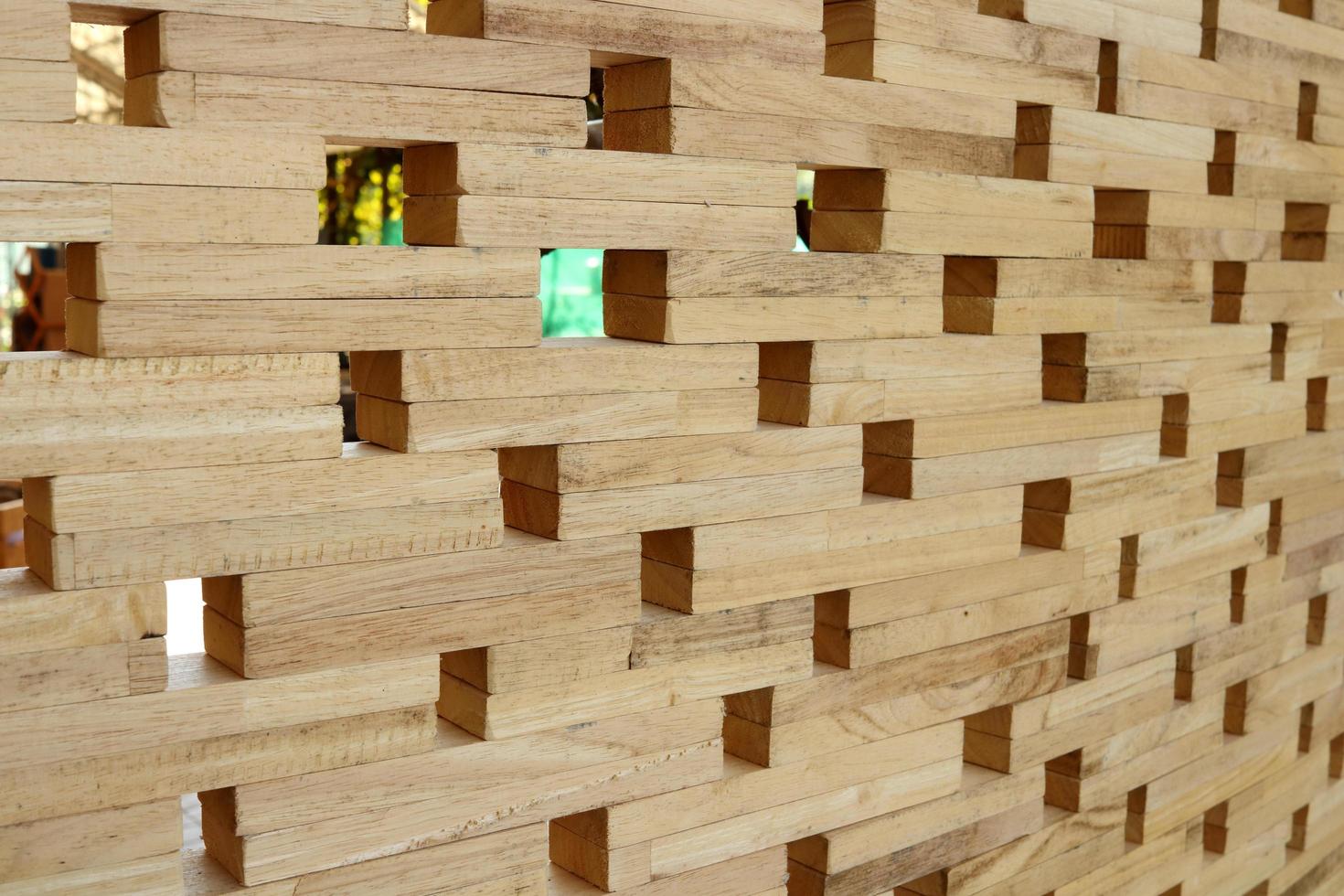 Wood wall made from small piece of timber, small square shape hole on broad.Beside perspective view of light brown wood and space background. photo