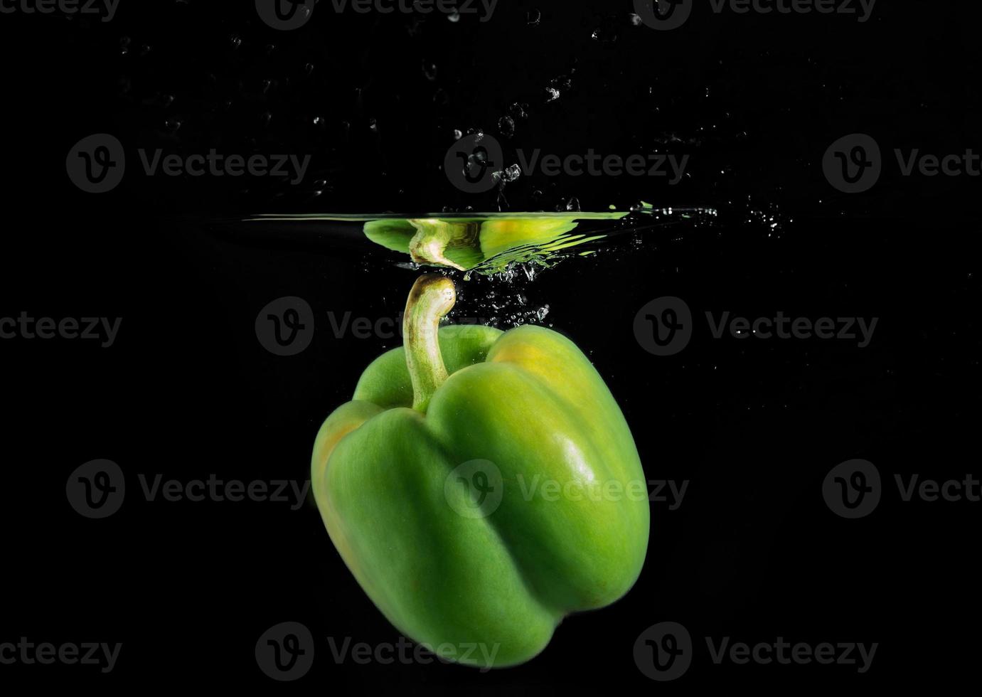 The colorful capsicum or bellpepper in the water photo