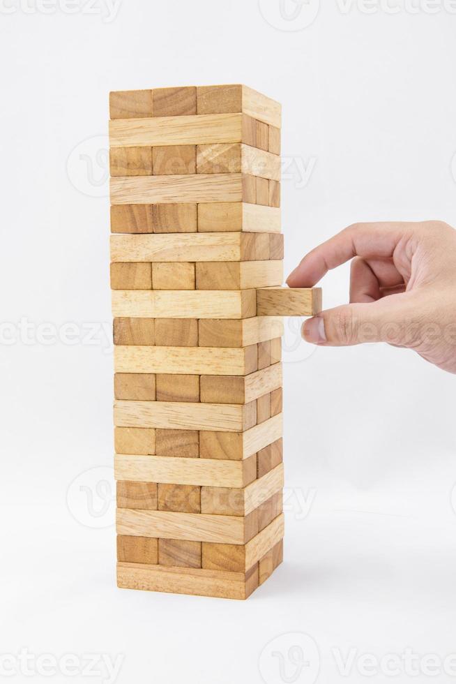 Blocks of wood and hand isolated on white background photo