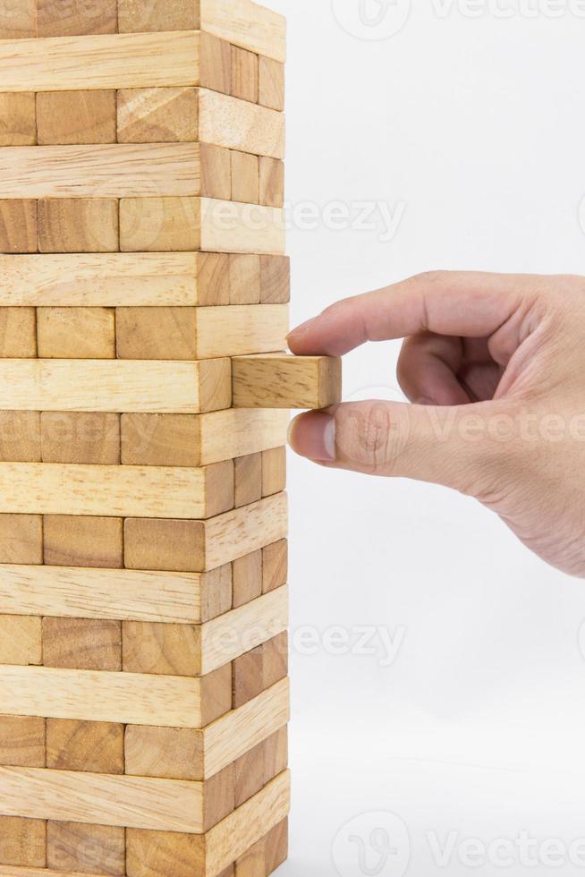 Blocks of wood and hand isolated on white background photo