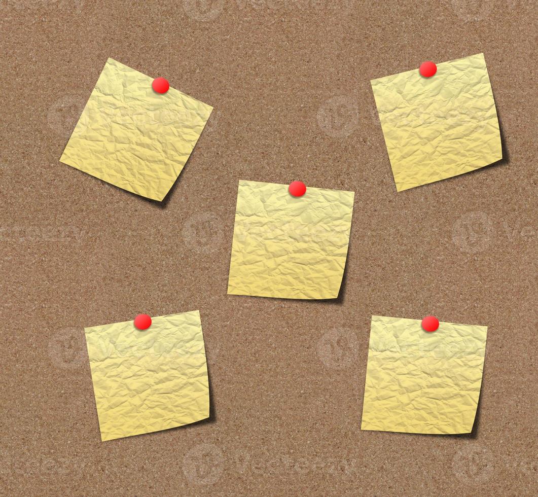 yellow sticky notes on sand board. photo