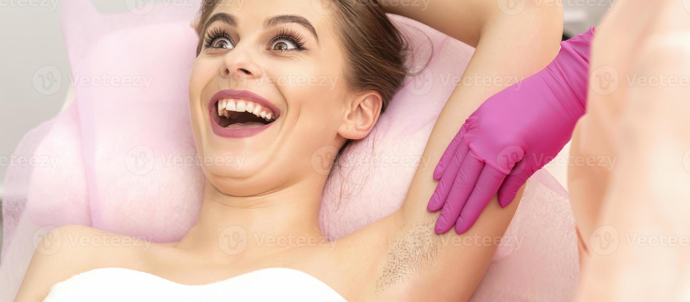 Young woman during armpit examination photo