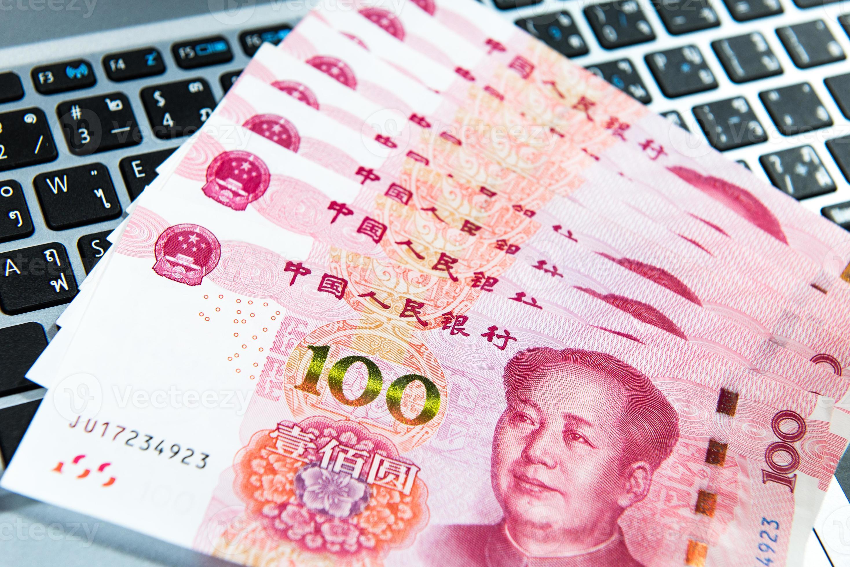 Yuan Or RMB Chinese Currency On Laptop s Keyboard 21897716 Stock Photo 1000-yuan-central-bank-with-holographic-strip-taiwan-numista