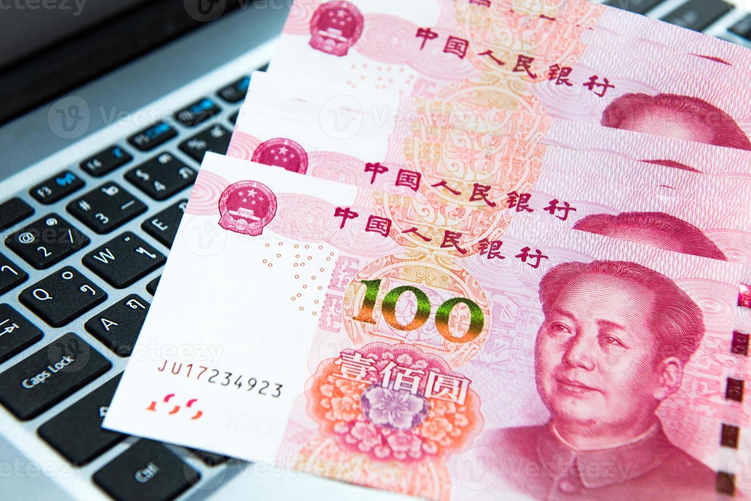 Yuan or RMB, Chinese Currency on laptop's keyboard photo