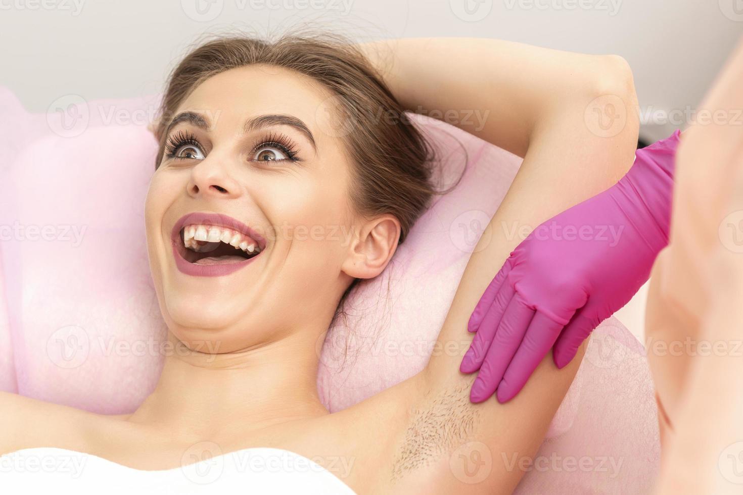 Young woman during armpit examination photo