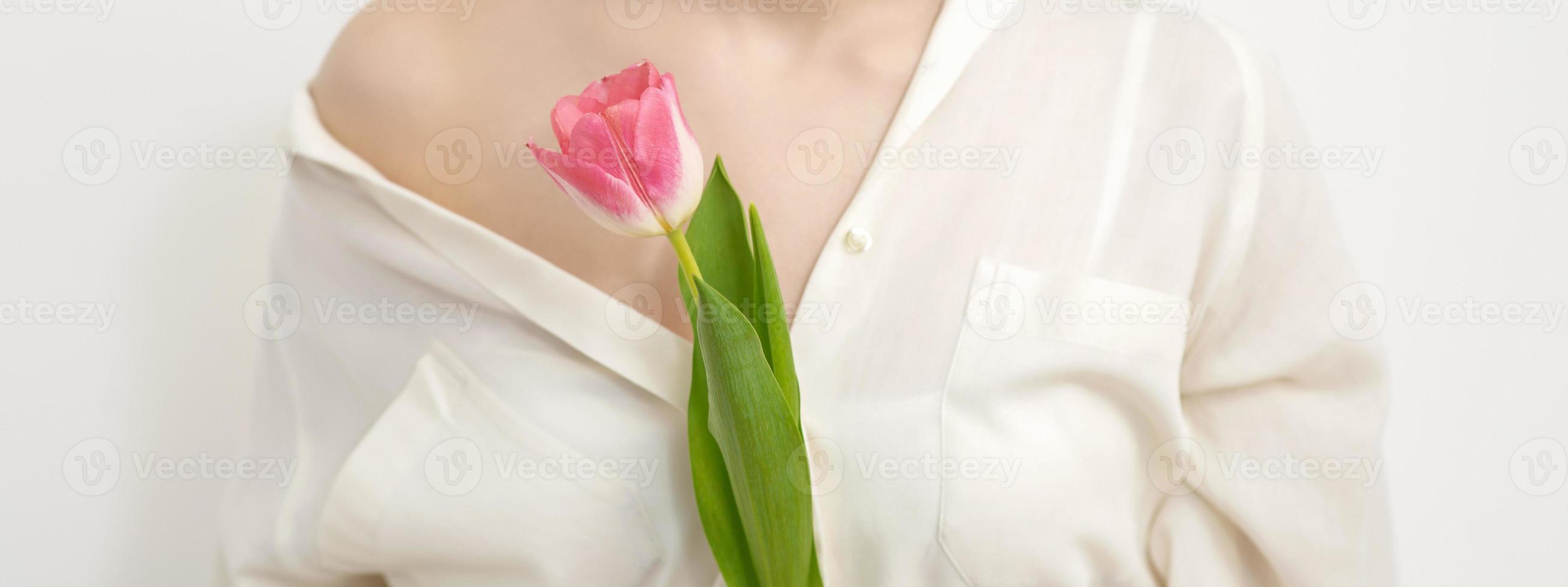 Young woman with one tulip photo