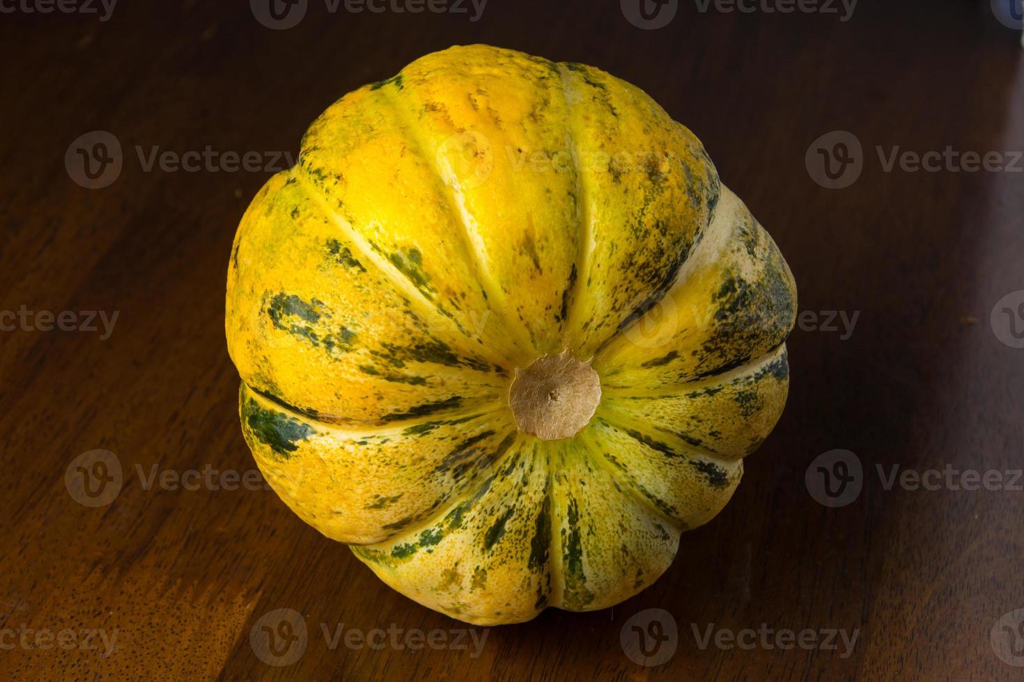 Blewah, Cantaloupe or Cucumis melo, a type of melon found in Indonesia, with a wooden background, cantaloupe is often used to make drinks during the fasting month of Ramadan photo