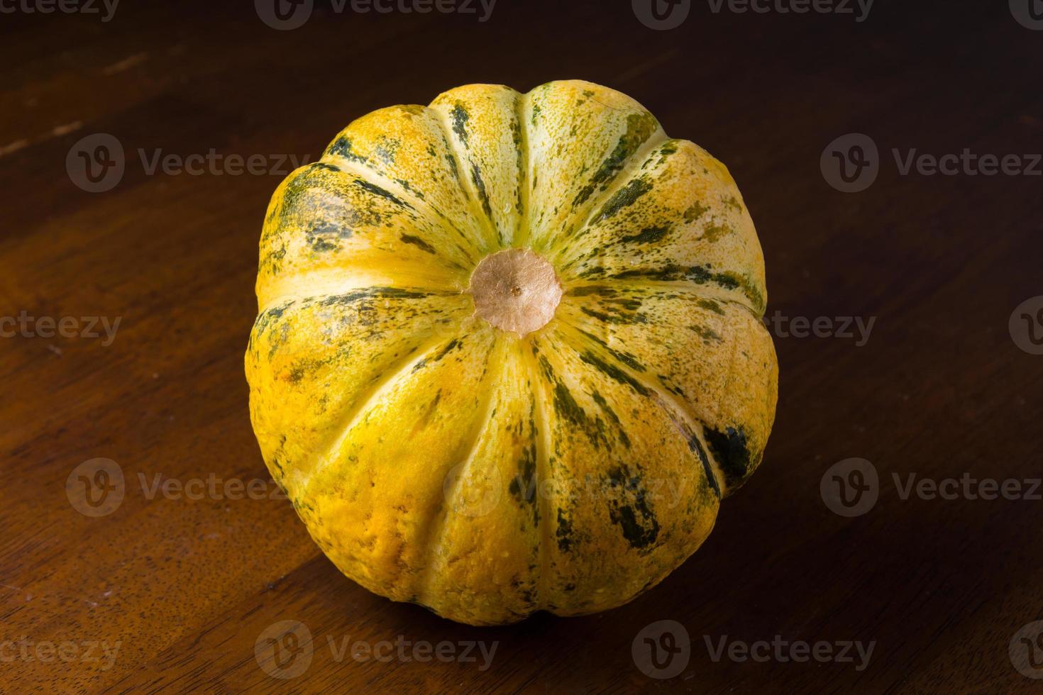 Blewah, Cantaloupe or Cucumis melo, a type of melon found in Indonesia, with a wooden background, cantaloupe is often used to make drinks during the fasting month of Ramadan photo