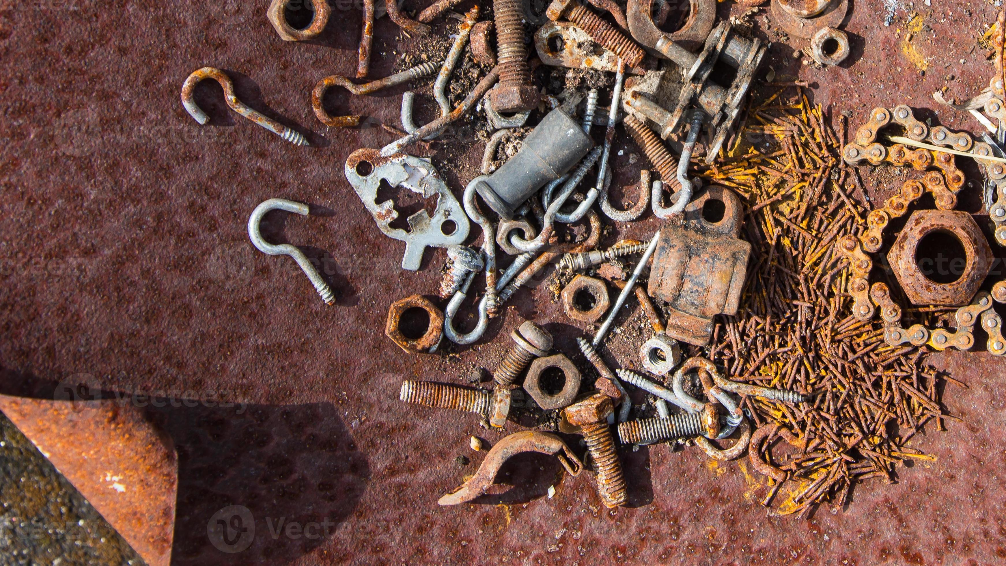 Rusted screws, nuts and bolts in a rusty iron case, rusty nails, rusty chains, These rusty metal